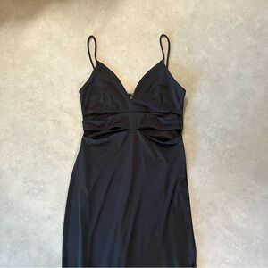 Dynamite Black Dress. Small. Long. Lined. Cut outs on the top. Stretchy. Slit.